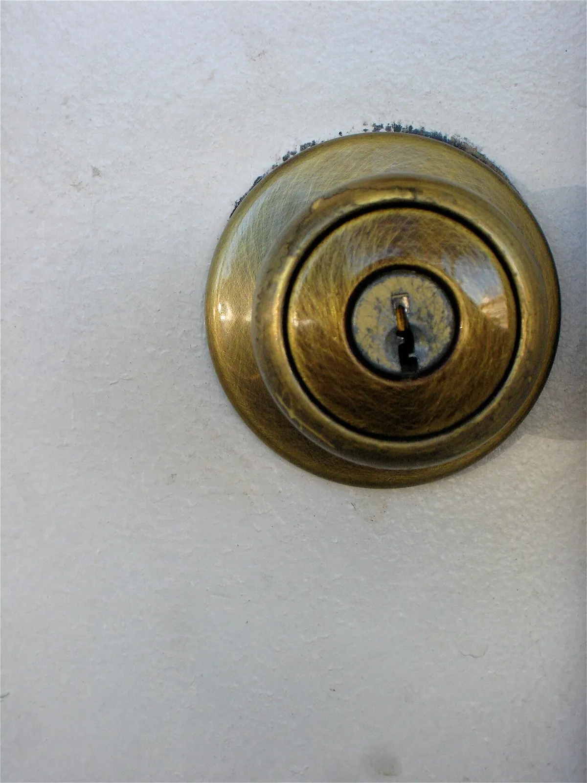 A deadbolt and handleset fitted to an entry door