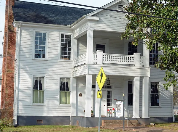 The Brown House, a white two-story historic home in McDonough, Georgia