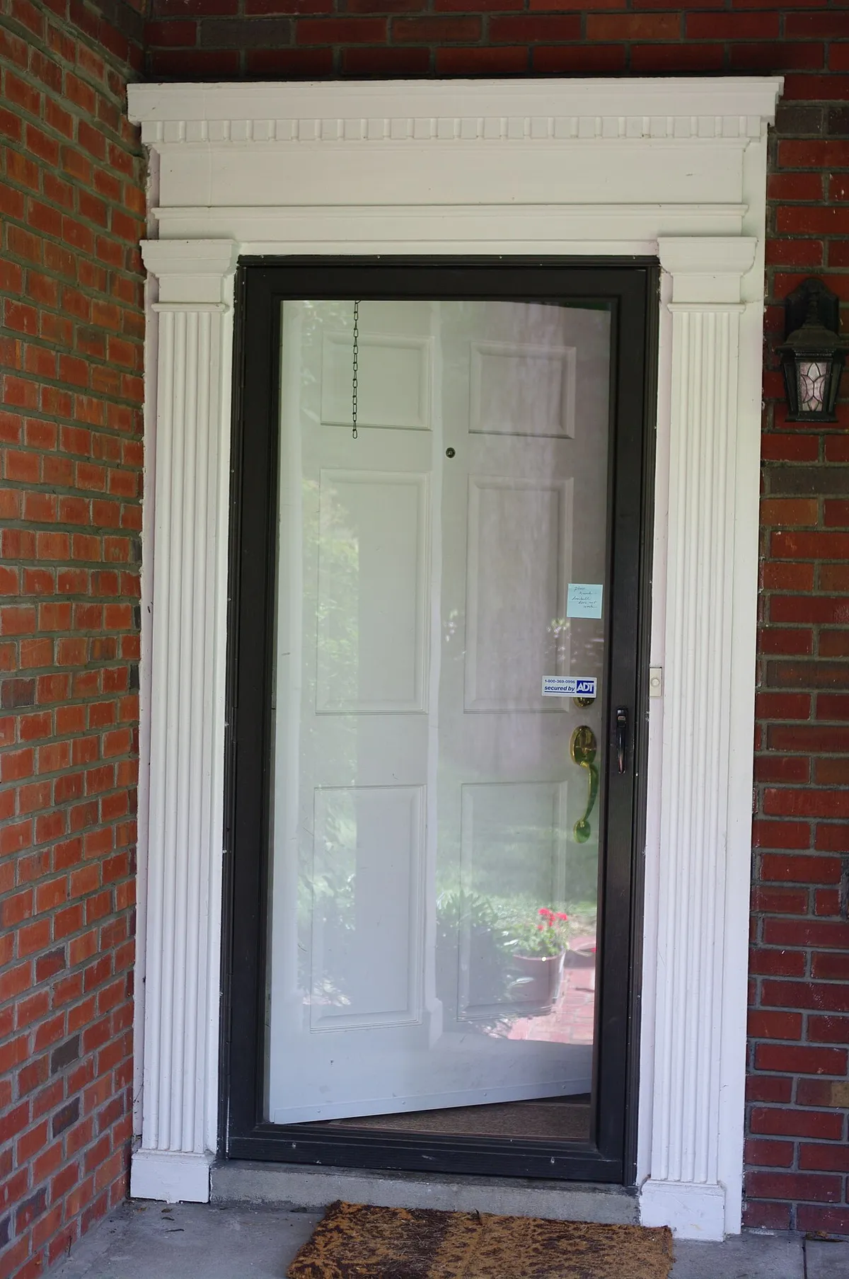 A storm door fitted over an entry door